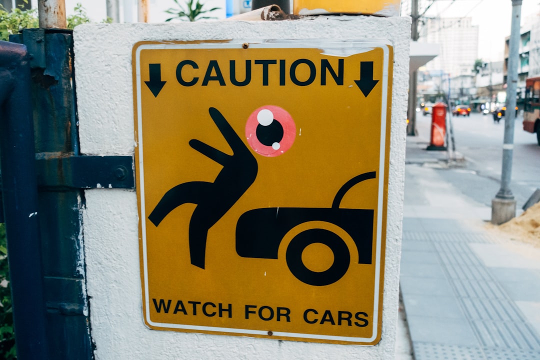 a caution sign on the side of a building