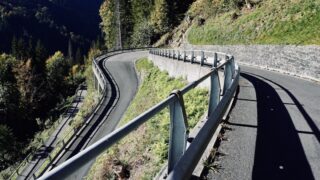 a curved road in the middle of a mountain